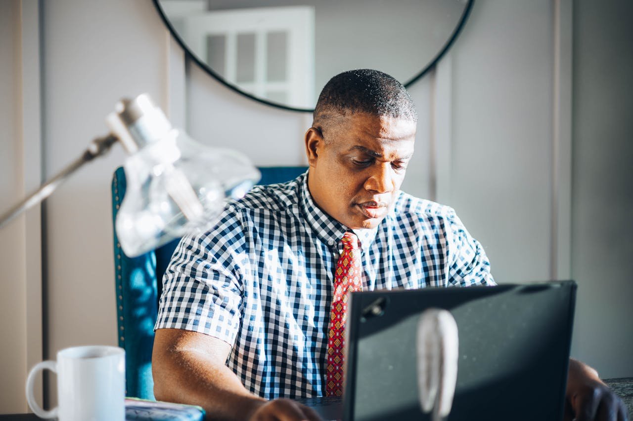 Man Working With Computer in His Office